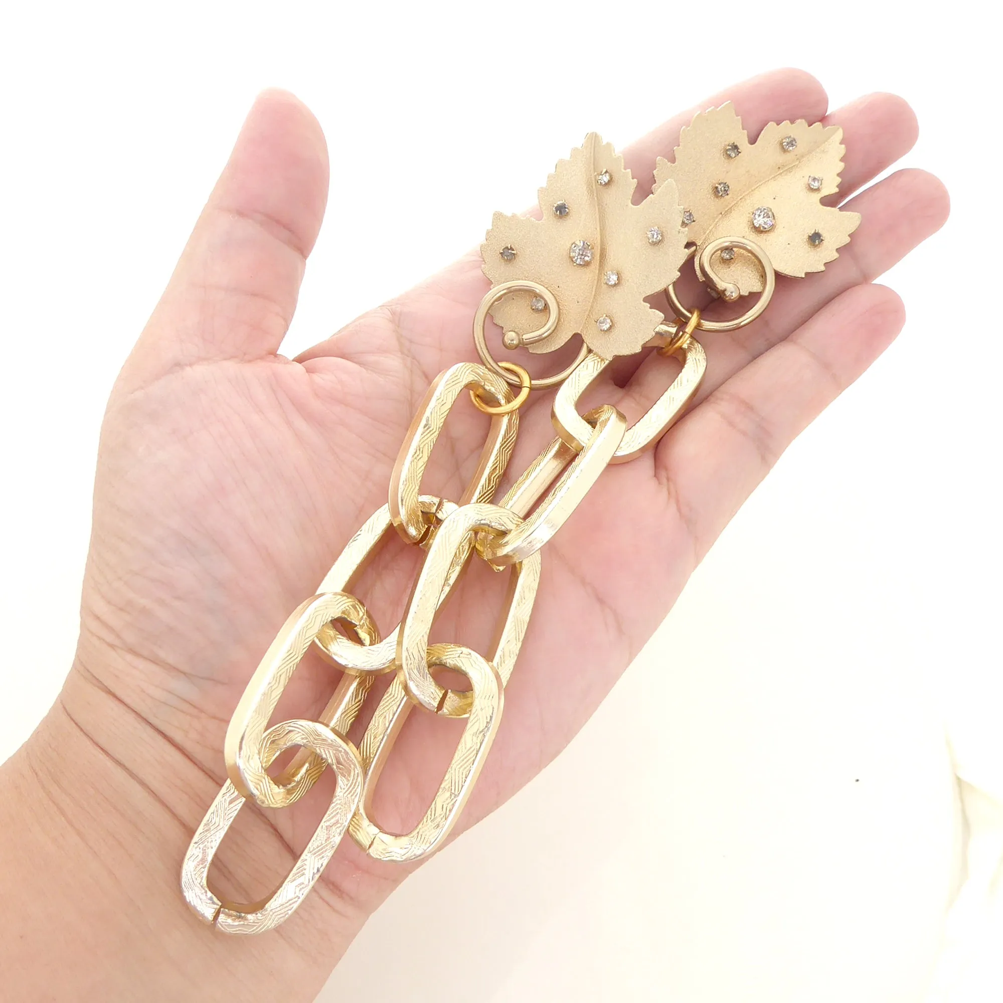 Gold rhinestone leaf earrings